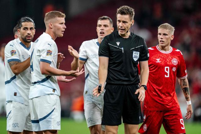 Referee Daniel Siebert (2nd R) gestures during the UEFA Nations League football match League A, Group A4, Day 1, Denmark v Switzerland in the Parken stadium in Copenhagen, Denmark, on September 5, 2024. (Photo by Mads Claus Rasmussen / Ritzau Scanpix / AFP) / Denmark OUT