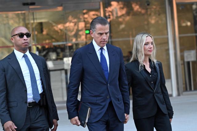 Hunter Biden (C), son of US President Joe Biden, and his wife Melissa Cohen, leave court after his guilty plea in his trail on tax evasion in Los Angeles, California, on September 5, 2024. US President Joe Biden's son, Hunter, pleaded guilty September 5, 2024 to all nine tax charges he faced, without reaching a deal with prosecutors. Before he entered the pleas in a Los Angeles court, US District Judge Mark Scarsi told him he could face up to 15 years in prison along with a $1 million fine. (Photo by Robyn Beck / AFP)