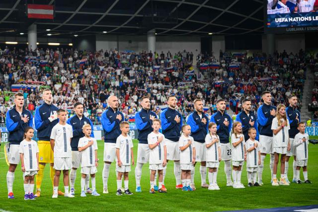 Slovenia’s national football team’s starting eleven stands prior to the kick off of the Group B3 Nations League football match between Slovenia and Austria at The Stadium Stozice in Ljubljana on September 6, 2024. (Photo by Jure Makovec / AFP)