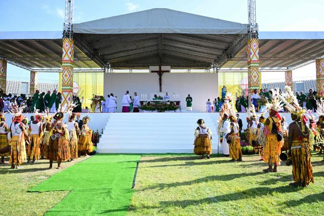 Pope Francis (C) leads holy mass at Sir John Guise Stadium in Port Moresby, Papua New Guinea, on September 8, 2024. Pope Francis is leading holy mass at the Sir Guise Stadium during his four day visit to Papua New Guinea from September 6-9. (Photo by Tiziana FABI / AFP)