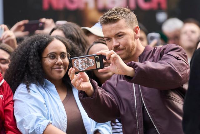 British actor Will Poulter takes selfies with fans as he attends the world premiere of "On Swift Horses" at the Princess of Wales theatre during the Toronto International Film Festival in Toronto, Ontario, on September 7, 2024. (Photo by Geoff Robins / AFP)