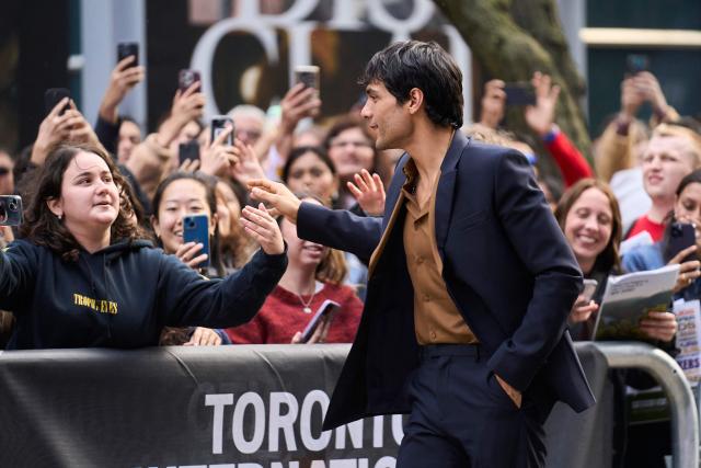 Mexican actor Diego Calva waves to fans as he attends the world premiere of "On Swift Horses" at the Princess of Wales theatre during the Toronto International Film Festival in Toronto, Ontario, on September 7, 2024. (Photo by Geoff Robins / AFP)