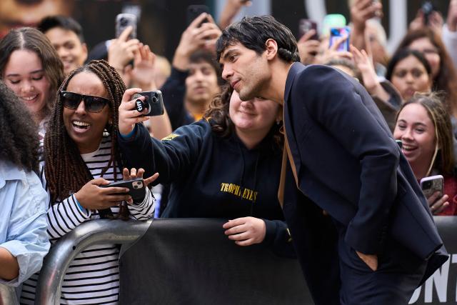 Mexican actor Diego Calva takes photos with fans as he attends the world premiere of "On Swift Horses" at the Princess of Wales theatre during the Toronto International Film Festival in Toronto, Ontario, on September 7, 2024. (Photo by Geoff Robins / AFP)