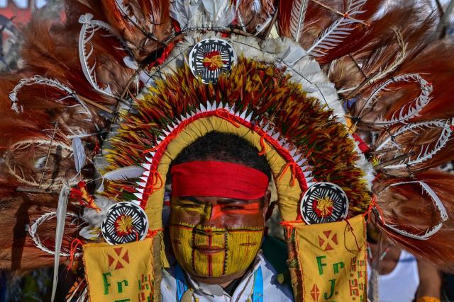 A person attends holy mass led by Pope Francis at Sir John Guise Stadium in Port Moresby, Papua New Guinea, on September 8, 2024. (Photo by Tiziana FABI / AFP)