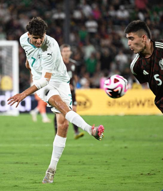 New Zealand's #07 Matthew Garbett shoots under pressure from Mexico's #05 Luis Romo during the international friendly football match between Mexico and New Zealand at the Rose Bowl Stadium in Pasadena, California, on September 7, 2024. (Photo by Frederic J. BROWN / AFP)