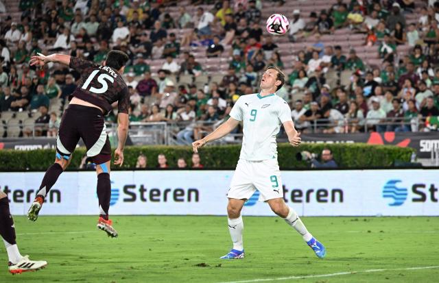 Mexico's #15 Israel Reyes clears the ball over New Zealand's #09 Chris Wood during the international friendly football match between Mexico and New Zealand at the Rose Bowl Stadium in Pasadena, California, on September 7, 2024. (Photo by Frederic J. BROWN / AFP)