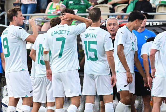 New Zealand's coach Darren Bazely has a word with his players during a water timeout in the international friendly football match between Mexico and New Zealand at the Rose Bowl Stadium in Pasadena, California, on September 7, 2024. (Photo by Frederic J. BROWN / AFP)