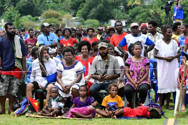 Faithful attend a holy mass lead by Pope Francis at Sir John Guise Stadium in Port Moresby, Papua New Guinea on September 8, 2024. Pope Francis is leading holy mass at the Sir Guise Stadium during his four day visit to Papua New Guinea from September 6-9. (Photo by Tiziana FABI / AFP)