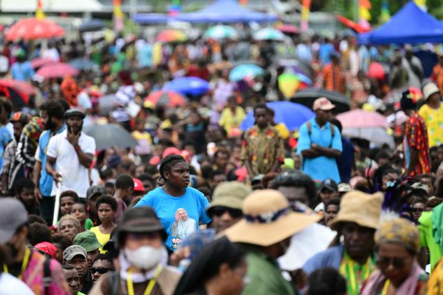 Faithful attend a holy mass lead by Pope Francis at Sir John Guise Stadium in Port Moresby, Papua New Guinea on September 8, 2024. Pope Francis is leading holy mass at the Sir Guise Stadium during his four day visit to Papua New Guinea from September 6-9. (Photo by Tiziana FABI / AFP)