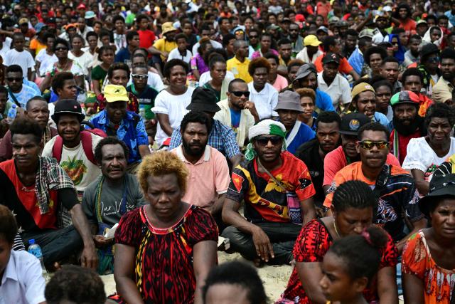 Faithful of the Diocese of Vanimo wait for the arrival of Pope Francis at the Esplanade in front of Holy Cross Cathedral in Vanimo, Papua New Guinea on September 8, 2024. (Photo by Tiziana FABI / AFP)