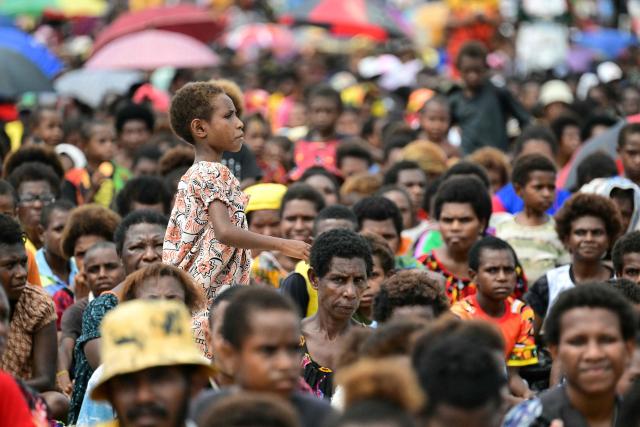 Faithful of the Diocese of Vanimo wait for the arrival of Pope Francis at the Esplanade in front of Holy Cross Cathedral in Vanimo, Papua New Guinea on September 8, 2024. (Photo by Tiziana FABI / AFP)