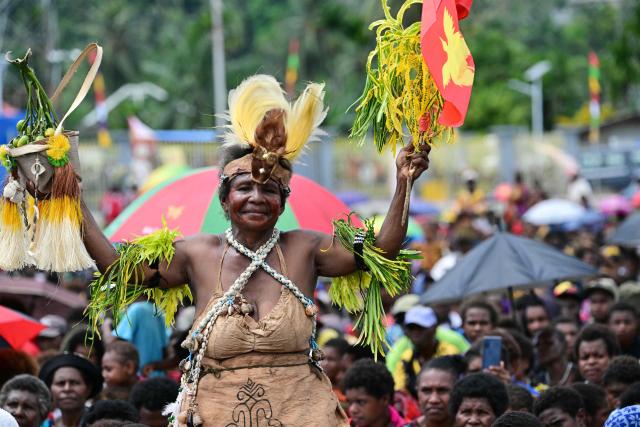 Faithful of the Diocese of Vanimo wait for the arrival of Pope Francis at the Esplanade in front of Holy Cross Cathedral in Vanimo, Papua New Guinea on September 8, 2024. (Photo by Tiziana FABI / AFP)