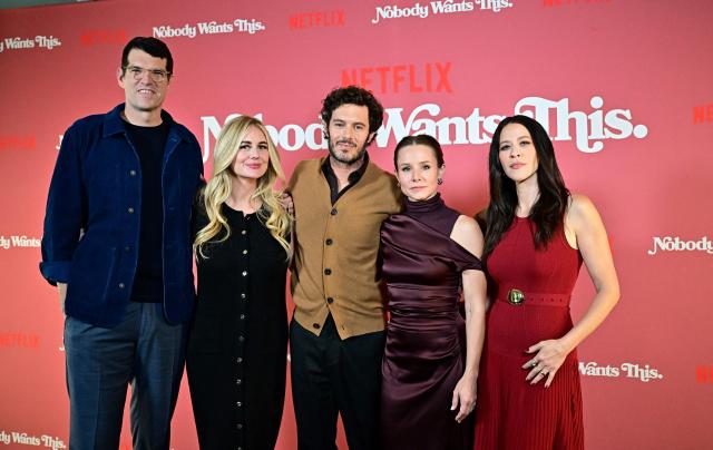 Actors Timothy Simons (L), Adam Brody (C) and actresses Justine Lupe (2nd L), Kristen Bell (2nd R)and Jackie Tohn (R) arrive at Netflix’s "Nobody Wants This" photocall in Los Angeles, California, on September 18, 2024. (Photo by Frederic J. BROWN / AFP)