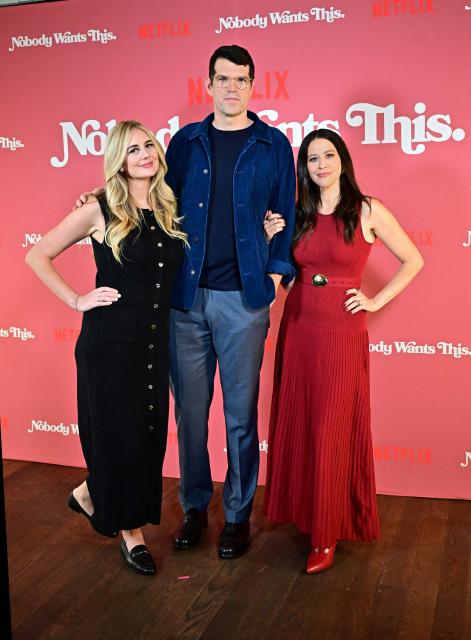 Actor Timothy Simons and actresses Justine Lupe (L) and Jackie Tohn arrive at Netflix’s "Nobody Wants This" photocall in Los Angeles, California, on September 18, 2024. (Photo by Frederic J. BROWN / AFP)