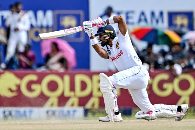 Sri Lanka's Dinesh Chandimal plays a shot during the third day of the first Test cricket match between Sri Lanka and New Zealand at the Galle International Cricket Stadium in Galle on September 20, 2024. (Photo by IDREES MOHAMMED / AFP)