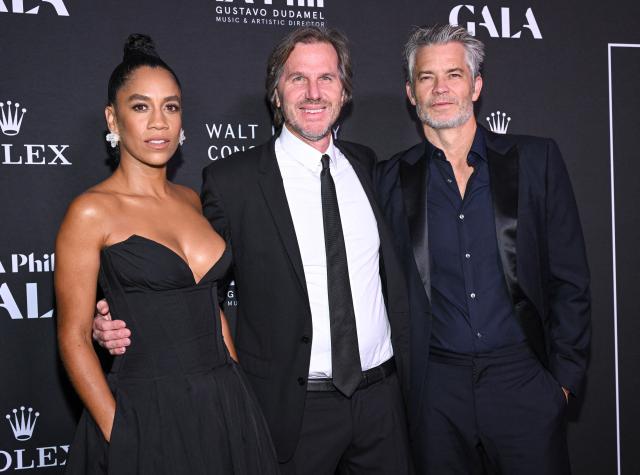 British actress Dominique Tipper (L), US director Breck Eisner (C) and US actor Timothy Olyphant attend the Los Angeles Philharmonic Gala Concert to kick-off the 2024/25 season at the Walt Disney concert hall in Los Angeles, October 1, 2024. (Photo by LISA O'CONNOR / AFP)