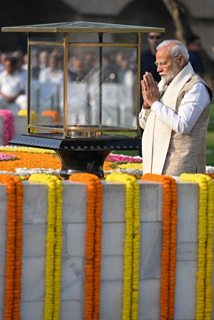 India's Prime Minister Narendra Modi pays respect on the occasion of Mahatma Gandhi's birth anniversary at his memorial in Rajghat, in New Delhi on October 2, 2024. (Photo by Sajjad HUSSAIN / AFP)