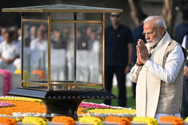 India's Prime Minister Narendra Modi pays respect on the occasion of Mahatma Gandhi's birth anniversary at his memorial in Rajghat, in New Delhi on October 2, 2024. (Photo by Sajjad HUSSAIN / AFP)