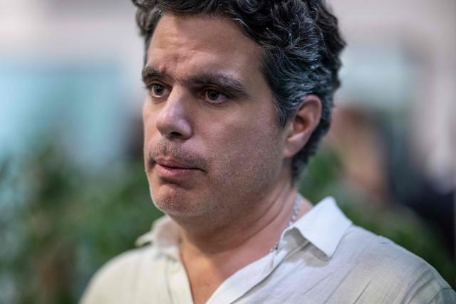 French/Spanish Charles Chamoun de Aranda, 49 years old, repatriated citizen, speaks to the press upon his arrival in the Portuguese Air Force C130 aircraft that brought 41 repatriated citizens on the flight from Beirut to Figo Maduro airport in Lisbon on October 4, 2024. The flight brought repatriated citizens from Beirut, Lebanon, 16 of whom are Portuguese, and the other family members are of other nationalities (8 from Lebanon, 5 from Spain, 8 from São Tomé, 1 from Brazil, 1 from Angola, 1 from Russia, and 1 from France). (Photo by PATRICIA DE MELO MOREIRA / AFP)