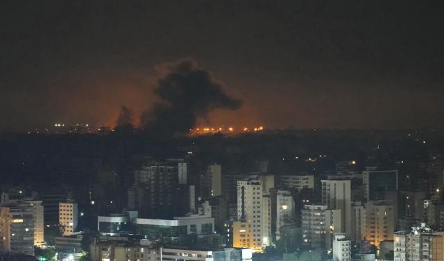 Smoke rises after an Israeli airstrike that targeted a neighborhood in Beirut’s southern suburbs on October 5, 2024. Israel's military launched an intensified wave of strikes on Hezbollah strongholds around Lebanon, killing more than 1,110 people since September 23, and forced hundreds of thousands to flee their homes in a country already mired in economic crisis. (Photo by ETIENNE TORBEY / AFP)