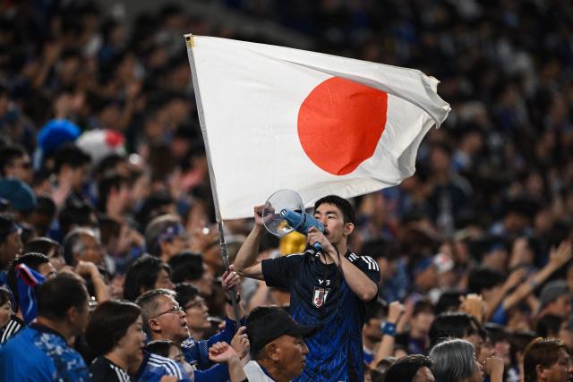 Japan's supporters react during the FIFA World Cup 2026 Asian zone qualifiers football between Japan and Australia at Saitama Stadium in Saitama on October 15, 2024. (Photo by Philip FONG / AFP)