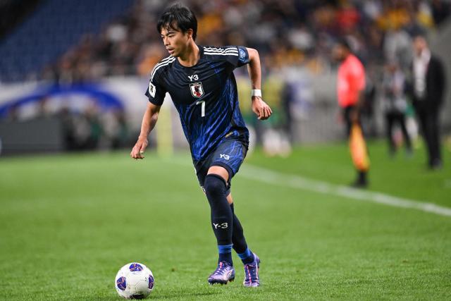 Japan's Kaoru Mitoma controls the ball during the FIFA World Cup 2026 Asian zone qualifiers football between Japan and Australia at Saitama Stadium in Saitama on October 15, 2024. (Photo by Philip FONG / AFP)