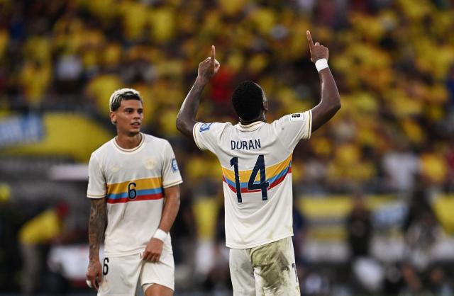 Colombia's forward #14 Jhon Durán celebrates next to Colombia's midfielder #06 Richard Ríos after scoring during the 2026 FIFA World Cup South American qualifiers football match between Colombia and Chile at the Roberto Melendez Metropolitan stadium in Barranquilla, Colombia, on October 15, 2024. (Photo by Raul ARBOLEDA / AFP)