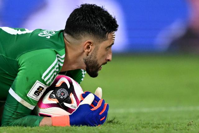 Colombia's goalkeeper #12 Camilo Vargas grabs the ball during the 2026 FIFA World Cup South American qualifiers football match between Colombia and Chile at the Roberto Melendez Metropolitan stadium in Barranquilla, Colombia, on October 15, 2024. (Photo by Luis ACOSTA / AFP)