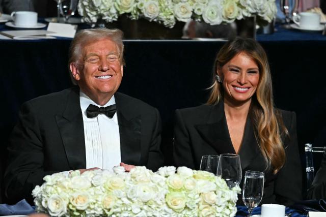 Former US President and Republican presidential candidate Donald Trump (L) and former US First Lady Melania Trump attend the 79th Annual Alfred E. Smith Memorial Foundation Dinner at the Hilton Midtown in New York, October 17, 2024. (Photo by Timothy A. CLARY / AFP)