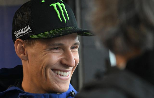 Monster Energy Yamaha MotoGP Team's French rider Fabio Quartararo relaxes in the garage as rain cancels the first practice session of the Australian MotoGP Grand Prix on Philip Island on October 18, 2024. (Photo by Paul CROCK / AFP)