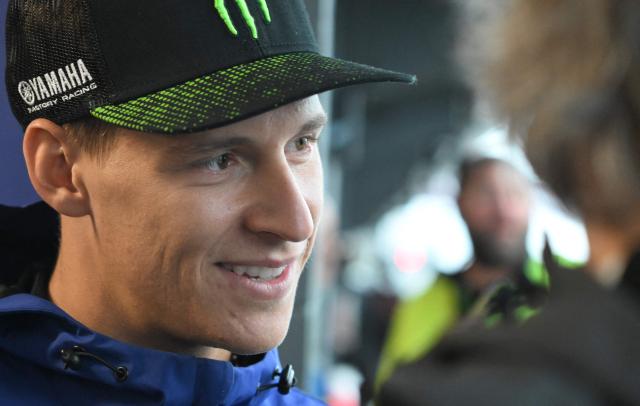 Monster Energy Yamaha MotoGP Team's French rider Fabio Quartararo relaxes in the garage as rain cancels the first practice session of the Australian MotoGP Grand Prix on Philip Island on October 18, 2024. (Photo by Paul CROCK / AFP)