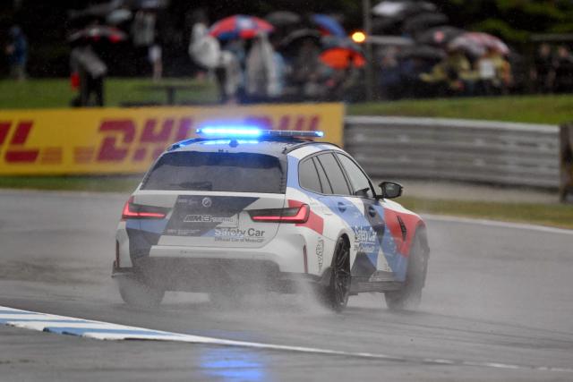 The safety car slides through a corner as rain delays the practice sessions at the Australian MotoGP on Philip Island on October 18, 2024. (Photo by William WEST / AFP)