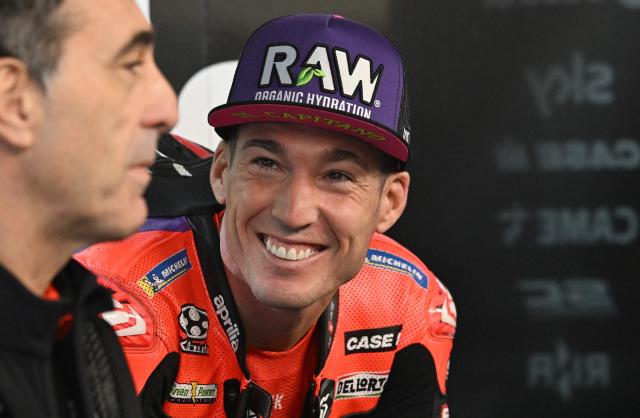 Aprilia Racing's Spanish rider Maverick Vinales relaxes in the garage as rain cancels the first practice session of the Australian MotoGP Grand Prix on Philip Island on October 18, 2024. (Photo by Paul CROCK / AFP)