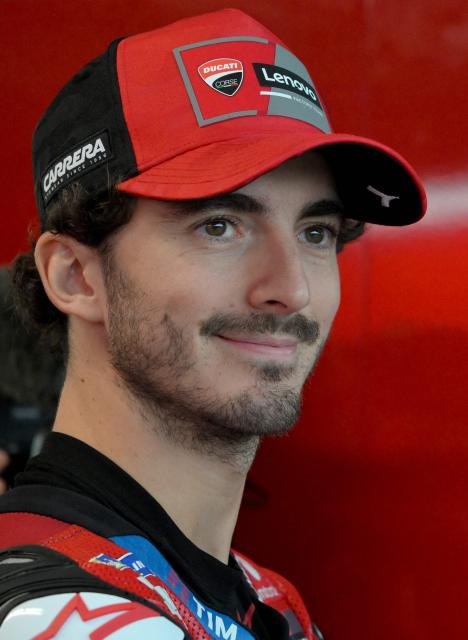 Ducati Lenovo Team's Italian rider Francesco Bagnaia relaxes in the garage as rain cancels the first practice session of the Australian MotoGP Grand Prix on Philip Island on October 18, 2024. (Photo by Paul CROCK / AFP)