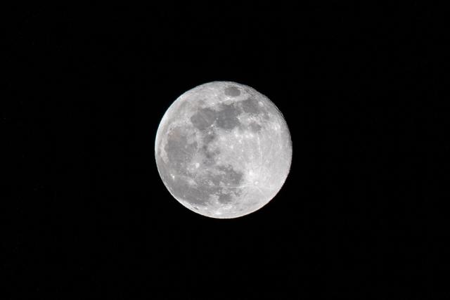 The "Hunter´s Moon" is pictured above Mexico City on October 17, 2024. (Photo by Yuri CORTEZ / AFP)