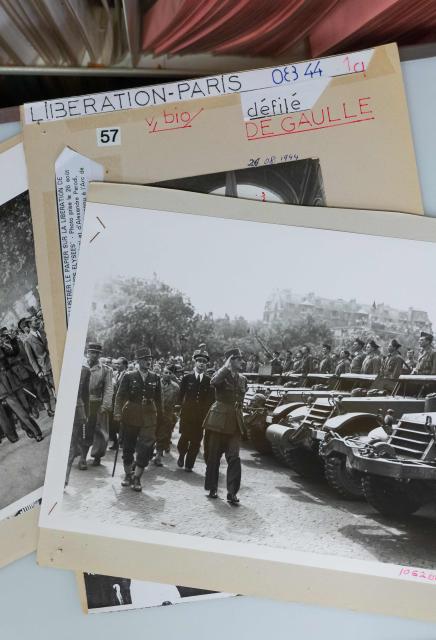 This photograph taken on October 14, 2024, shows contact sheets and photographs depicting French General de Gaulle during the August 26, 1944 parade following the Liberation of Paris. In a documentary broadcasted from October 18, 2024 to mark its 80th anniversary, AFP has searched for Marcelle Poirier, its first female war correspondent in 1944, forgotten by history, who was covering the arrival of French General de Gaulle in France in August 1944. (Photo by Laurent KALFALA / AFP)