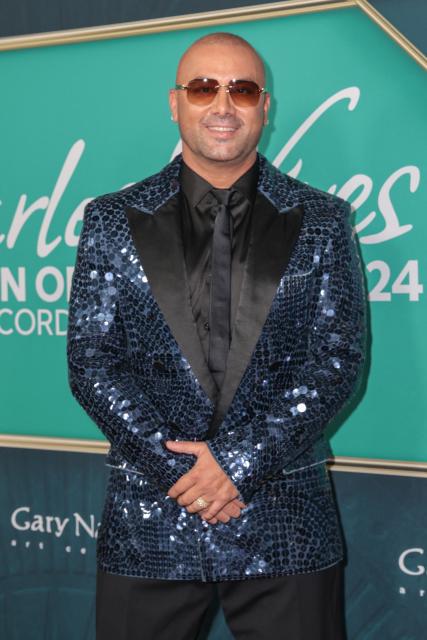 Puerto Rican rapper Wisin attends the Latin Recording Academy's Person Of The Year gala at the Miami Beach Convention Center in Miami Beach on November 13, 2024. (Photo by Giorgio Viera / AFP)