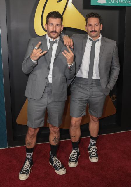 Mauricio Alberto "Mau" Reglero Rodriguez and Ricardo Andres "Ricky" Reglero Rodriguez from Venezuelan duo Mau y Ricky attend the Latin Recording Academy's Person Of The Year gala at the Miami Beach Convention Center in Miami Beach, Florida on November 13, 2024. (Photo by Giorgio Viera / AFP)