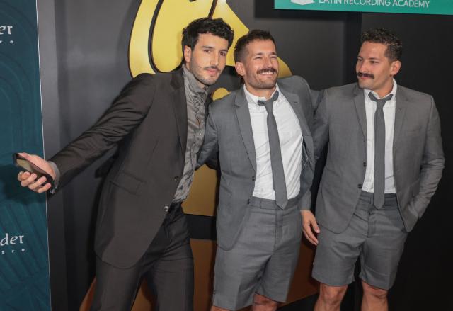 Colombian singer Sebastian Yatra (L) poses with Mauricio Alberto "Mau" Reglero Rodriguez and Ricardo Andres "Ricky" Reglero Rodriguez from Venezuelan duo Mau y Ricky as they attend the Latin Recording Academy's Person Of The Year gala at the Miami Beach Convention Center in Miami Beach, Florida on November 13, 2024. (Photo by Giorgio Viera / AFP)