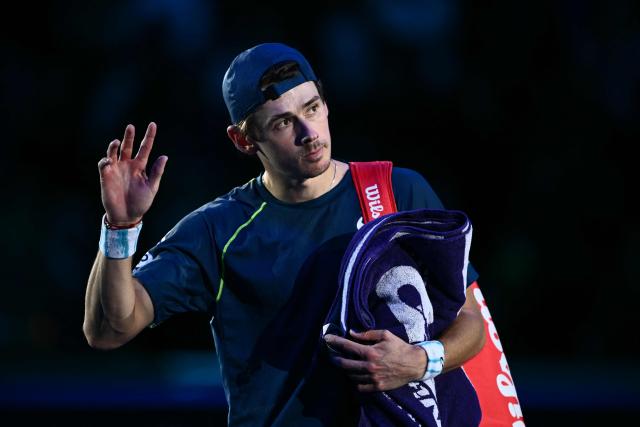 Australia's Alex De Minaur waves after being defeated by USA's Taylor Fritz during their match at the ATP Finals tennis tournament in Turin on November 14, 2024. (Photo by Marco BERTORELLO / AFP)