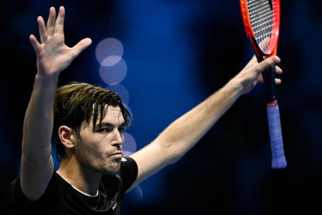 USA's Taylor Fritz celebrates after victory against Australia's Alex De Minaur during their match at the ATP Finals tennis tournament in Turin on November 14, 2024. (Photo by Marco BERTORELLO / AFP)