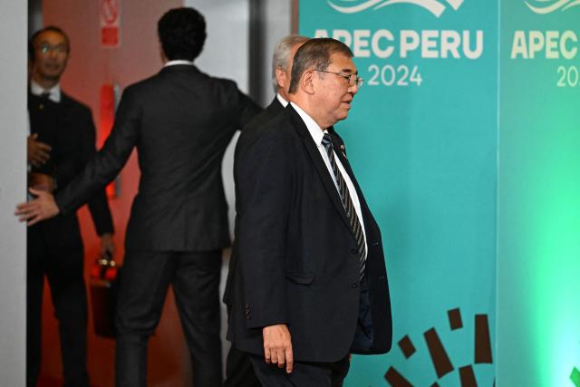 Japan's Prime Minister Shigeru Ishiba arrives at the APEC Economic Leaders’ Meeting (AELM) at the Convention Centre in Lima, on November 16, 2024. (Photo by Luis ACOSTA / AFP)