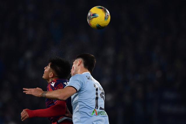 Bologna's Argentine forward #09 Santiago Castro fights for the ball with Lazio's Italian defender #13 Alessio Romagnoli during the Italian Serie A football match between Lazio and Bologna at the Olympic Stadium in Rome on November 24, 2024. (Photo by Filippo MONTEFORTE / AFP)