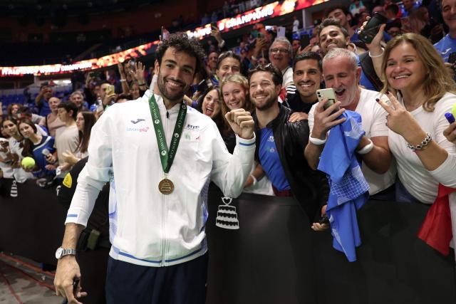 Italy's Matteo Berrettini poses with fans after Italy's victory over Netherlands in the Davis Cup Finals at the Palacio de Deportes Jose Maria Martin Carpena arena in Malaga, southern Spain, on November 24, 2024. (Photo by Thomas COEX / AFP)