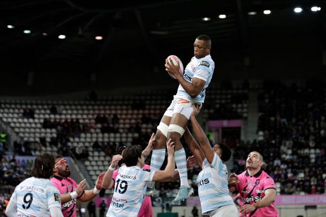 Racing92's French lock Cameron Woki (top) grabs the ball in a line-out during the French TOP 14 Rugby Union match between Stade Francais and Racing 92 at Jean Bouin stadium in Paris, on November 24, 2024. (Photo by STEPHANE DE SAKUTIN / AFP)