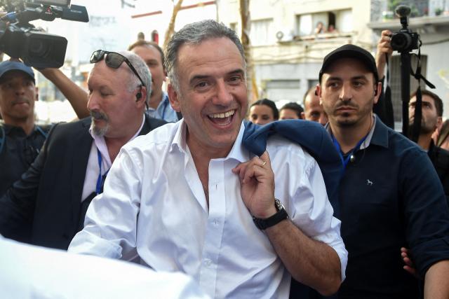 Uruguay's presidential candidate for the Frente Amplio party, Yamandu Orsi, arrives at his bunker in the NH hotel to wait for the results of the presidential runoff election in Montevideo on November 24, 2024. Left-wing candidate Yamandu Orsi was projected to win Uruguay's presidential election, media reported Sunday, in a rebuke by voters of five years of conservative rule. Uruguayans went to the polls for the second round of voting in what became a tight race between Orsi and Alvaro Delgado of the National Party, a member of outgoing President Luis Lacalle Pou's center-right Republican Coalition. (Photo by DANTE FERNANDEZ / AFP)