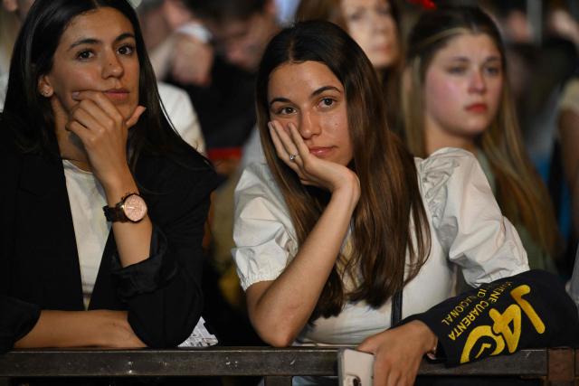 Supporters of Uruguay's presidential candidate for the Republican Coalition, Alvaro Delgado, react following the first results of the presidential runoff election in Montevideo on November 24, 2024. The leftist Yamandu Orsi of the opposition Frente Amplio coalition and a protйgй of former president Jose ‘Pepe’ Mujica, won the second round of Uruguay's presidential election on Sunday, according to television projections. (Photo by Eitan ABRAMOVICH / AFP)