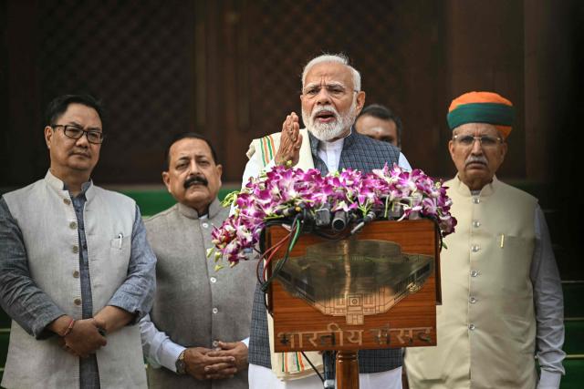 India's Prime Minister Narendra Modi (2R) addresses the media upon his arrival on the first day of the winter session of the parliament in New Delhi on November 25, 2024. (Photo by Sajjad HUSSAIN / AFP)