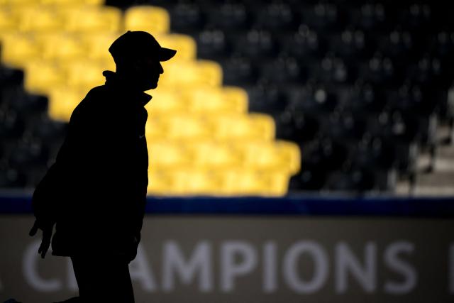 Young Boys' Swiss head coach Joel Magnin is seen silhouetted during a practice session on the eve of the UEFA Champions League football match between Young Boys and Atalanta, at the Wankdorf Stadium in Bern on November 25, 2024. (Photo by Fabrice COFFRINI / AFP)