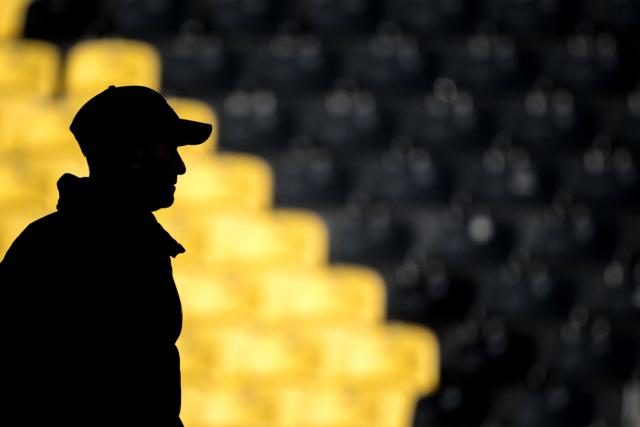 Young Boys' Swiss head coach Joel Magnin is seen silhouetted during a practice session on the eve of the UEFA Champions League football match between Young Boys and Atalanta, at the Wankdorf Stadium in Bern on November 25, 2024. (Photo by Fabrice COFFRINI / AFP)